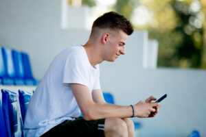 Young man scheduling a reminded to take an exercise snack