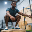 Man performing box jumps as part of concurrent training routine