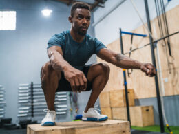 Man performing box jumps as part of concurrent training routine