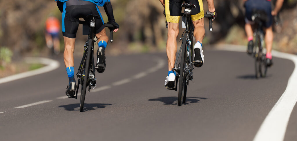 Close-up of a cyclist's feet on bike pedals, demonstrating efficient pedaling technique